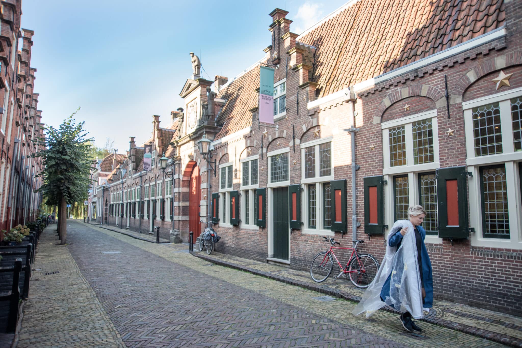 A woman walking in front of Frans Hals Museum Haarlem